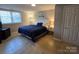 Comfortable bedroom with a plush bed, soft lighting, and neutral decor at 3127 N Center St, Hickory, NC 28601