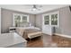 A brightly lit bedroom featuring hardwood floors and neutral decor at 3127 N Center St, Hickory, NC 28601