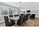 Bright dining room with stylish lighting, table set with seating for six, and hardwood floors at 3127 N Center St, Hickory, NC 28601