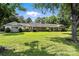 Expansive ranch-style home featuring a large, well-maintained lawn and mature trees at 3127 N Center St, Hickory, NC 28601