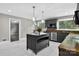 Gray cabinets, stainless steel appliances, a kitchen island, and marble floor in this spacious kitchen at 3127 N Center St, Hickory, NC 28601