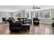 Elegant living room with hardwood floors, bright windows, and stylish leather furniture at 3127 N Center St, Hickory, NC 28601