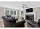 Inviting living room with a fireplace, flat screen tv and large bright windows at 3127 N Center St, Hickory, NC 28601
