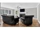 Cozy living room featuring a fireplace, hardwood floors, and comfortable seating at 3127 N Center St, Hickory, NC 28601