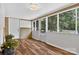 A bright sunroom with wood-look tile flooring, and lots of windows for natural light at 3127 N Center St, Hickory, NC 28601