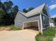 Attached two-car garage with spacious driveway, gray siding, and convenient access to the home at 3218 Player Ct, Salisbury, NC 28144