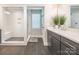 Modern bathroom featuring a glass-enclosed shower and double vanity sink at 3227 Cape Fox Ct, Denver, NC 28037