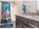 Bathroom with a vanity, shower-tub combo, granite countertop, and quirky decor at 3227 Cape Fox Ct, Denver, NC 28037
