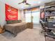 Bedroom with sports-themed decor, ceiling fan, and cozy furnishings at 3227 Cape Fox Ct, Denver, NC 28037