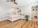 Bedroom showing floors, bed with decorative pillows, and good lighting at 3227 Cape Fox Ct, Denver, NC 28037