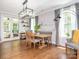 Bright dining room with stylish decor, large windows, and a view of the screened-in porch at 3227 Cape Fox Ct, Denver, NC 28037