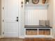 Functional entryway with built-in bench seating, storage baskets, and coat hooks, offering a welcoming and organized space at 3227 Cape Fox Ct, Denver, NC 28037