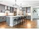 Modern kitchen featuring an island with barstool seating, pendant lighting, and stainless steel appliances at 3227 Cape Fox Ct, Denver, NC 28037