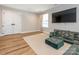 Inviting living room with plush seating, a large television, and warm natural light at 3227 Cape Fox Ct, Denver, NC 28037