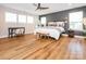 Stylish main bedroom with hardwood floors, modern lighting, and a cozy bench at 3227 Cape Fox Ct, Denver, NC 28037