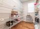 A walk-in pantry featuring organized wire shelving and hardwood flooring at 3227 Cape Fox Ct, Denver, NC 28037