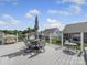 Enjoy outdoor dining on this spacious back deck with a table, chairs, and umbrella on a sunny day at 3317 Black Cherry Dr, Monroe, NC 28110