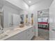 Bright bathroom with double vanity, stone countertops, and access to the main bedroom at 3317 Black Cherry Dr, Monroe, NC 28110