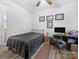Bedroom featuring a desk, neutral walls, and ceiling fan offering comfort and functionality at 3317 Black Cherry Dr, Monroe, NC 28110