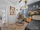 A bedroom featuring unique decor, a hanging chair, and comfortable furnishings providing personality at 3317 Black Cherry Dr, Monroe, NC 28110