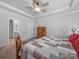 Comfortable bedroom with a patchwork quilt, neutral walls, and ceiling fan for a calming retreat at 3317 Black Cherry Dr, Monroe, NC 28110