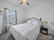 Well-lit bedroom with a ceiling fan, window, and comfortable bed, creating a relaxing atmosphere at 3317 Black Cherry Dr, Monroe, NC 28110