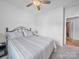 Bright bedroom with a ceiling fan, neutral walls, and comfortable bed, providing a tranquil space at 3317 Black Cherry Dr, Monroe, NC 28110