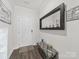 Bright entryway featuring a decorative mirror, bench, and neutral decor, creating a welcoming space at 3317 Black Cherry Dr, Monroe, NC 28110