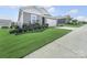 Beautiful single-story home showcasing a lush green lawn and a two-car attached garage at 3317 Black Cherry Dr, Monroe, NC 28110