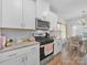 Well-lit kitchen features granite countertops, stainless steel appliances, and an eat-in dining area at 3317 Black Cherry Dr, Monroe, NC 28110