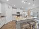 Spacious kitchen with an island, granite countertops, stainless steel appliances, and modern lighting at 3317 Black Cherry Dr, Monroe, NC 28110