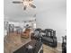 Living space with fireplace, seating, dining, and kitchen area with white cabinetry at 3317 Black Cherry Dr, Monroe, NC 28110