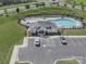 Aerial shot of a pristine community pool, parking lot, and pool house at 3317 Black Cherry Dr, Monroe, NC 28110
