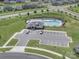 Aerial view of a community pool with lounge chairs and parking area at 3317 Black Cherry Dr, Monroe, NC 28110