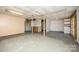 Basement with concrete floors and a door at 38367 Loblolly Ln, New London, NC 28127