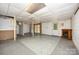 Basement with concrete floors, fireplace, and a door at 38367 Loblolly Ln, New London, NC 28127