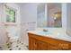 Bathroom with a mirror, toilet, and tile flooring at 38367 Loblolly Ln, New London, NC 28127