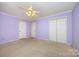Spacious bedroom with carpet floors, ceiling fan and closet at 38367 Loblolly Ln, New London, NC 28127