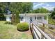 Charming single-story home with a covered porch and accessible ramp at 38367 Loblolly Ln, New London, NC 28127