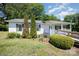 Inviting exterior of a one-story home with well-maintained landscaping and covered porch at 38367 Loblolly Ln, New London, NC 28127