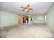 Spacious living room showing the kitchen and rear exit at 38367 Loblolly Ln, New London, NC 28127