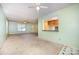 View of the living room and kitchen area with connecting breakfast bar at 38367 Loblolly Ln, New London, NC 28127