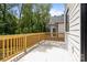 Spacious outdoor deck with wooden railing, perfect for entertaining or relaxing at 3937 Plainview Rd, Charlotte, NC 28208