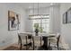 Elegant dining room featuring modern light fixture and neutral decor at 3937 Plainview Rd, Charlotte, NC 28208