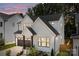 Beautiful modern farmhouse with white siding, black trim, and a two-car garage at 3937 Plainview Rd, Charlotte, NC 28208