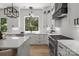 Kitchen features a large window over the sink and stainless steel stove at 3937 Plainview Rd, Charlotte, NC 28208