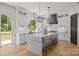 Open kitchen with a large island and lots of natural light at 3937 Plainview Rd, Charlotte, NC 28208
