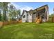 Beautiful backyard with a spacious lawn and a screened porch, perfect for outdoor living at 3945 Plainview Rd, Charlotte, NC 28208