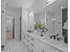 Bright bathroom featuring dual sinks, modern fixtures, and sleek design at 3945 Plainview Rd, Charlotte, NC 28208
