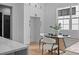 A bright breakfast nook with modern dining furniture and natural light, adjacent to the kitchen at 3945 Plainview Rd, Charlotte, NC 28208